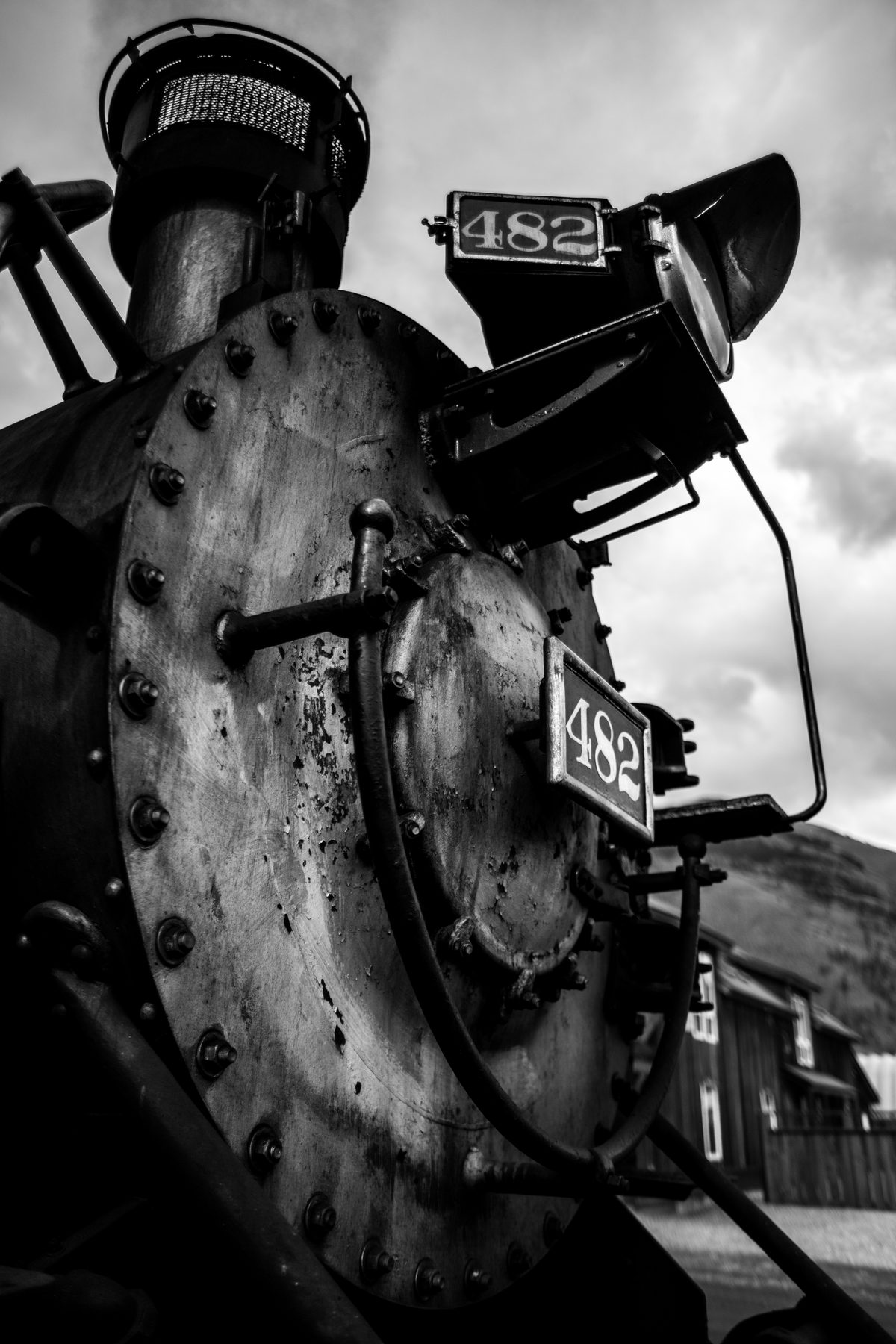 Black and white detail of the smokebox and headlamp of steam locomotive 482